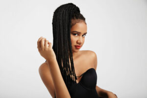 black woman with african braids. natural hair